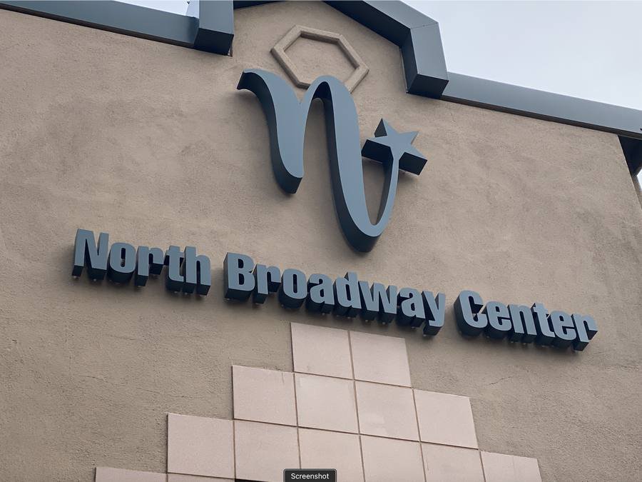 North Broadway Center illuminated sign at night